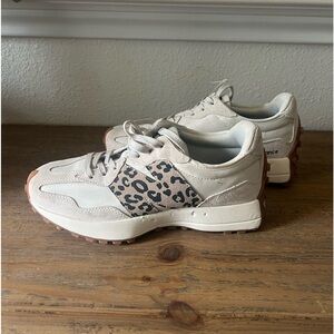 New, but dog got ahold of. Never worn. New Balance